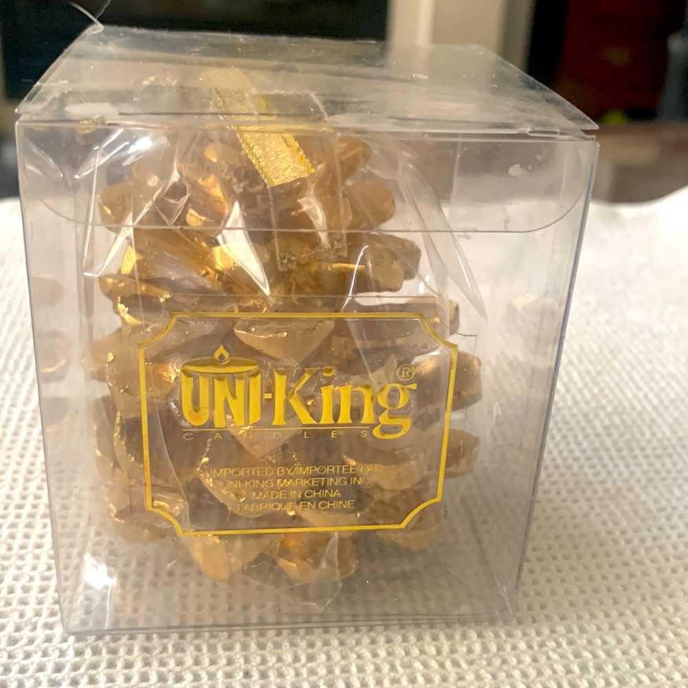 New gold pine cone shaped candle
